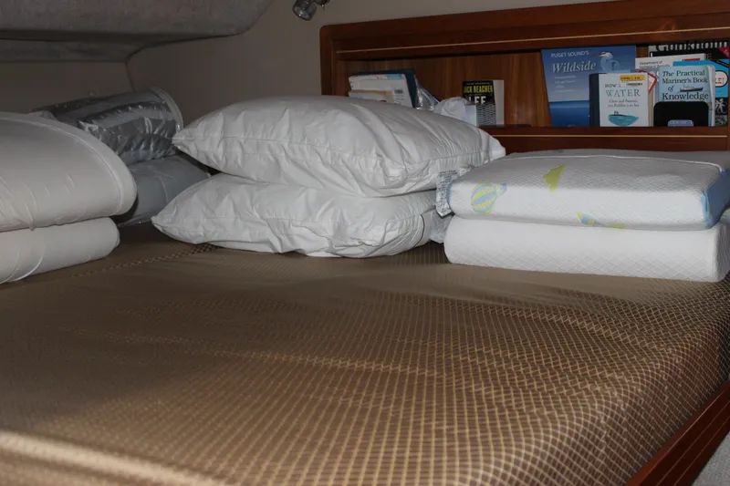 Slide: The Image of Cozy cabin bed with pillows and books, Aspen B100, 2016 model. - 12