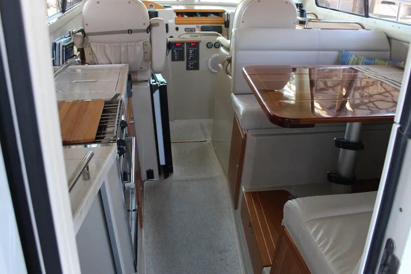 Slide: The Image of Interior of 2016 Aspen B100 boat with kitchen and seating area. - 16