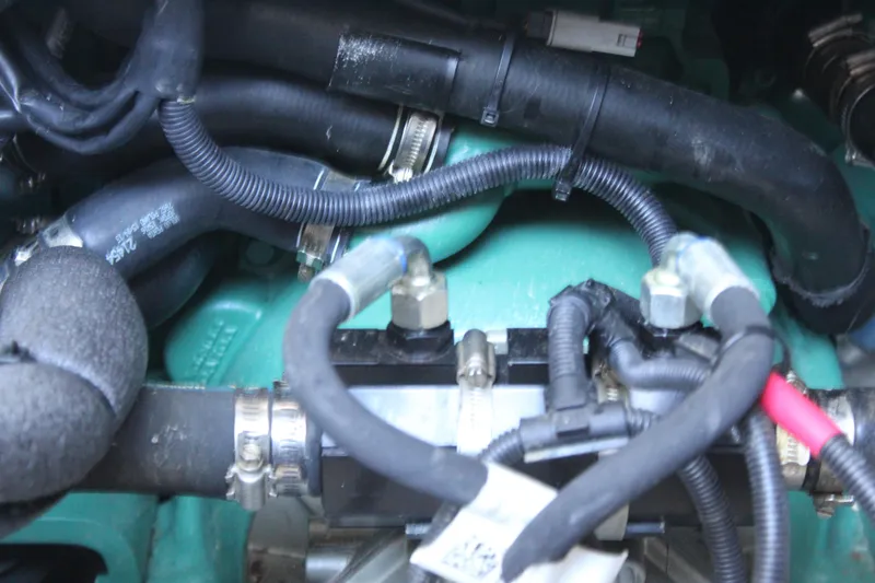 Slide: The Image of Close-up of Aspen B100 2016 engine components with hoses and wiring. - 9