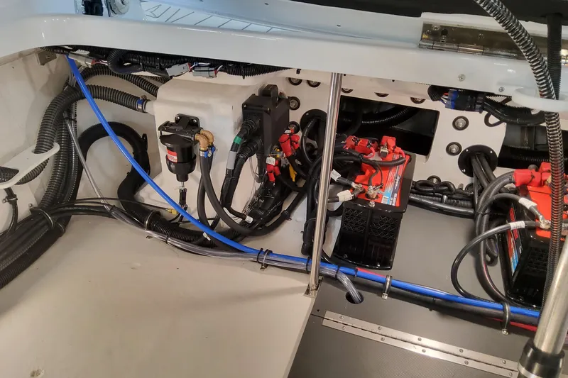 Slide: The Image of 2026 Formula 310 Bowrider OB engine compartment with wiring and battery setup. - 100