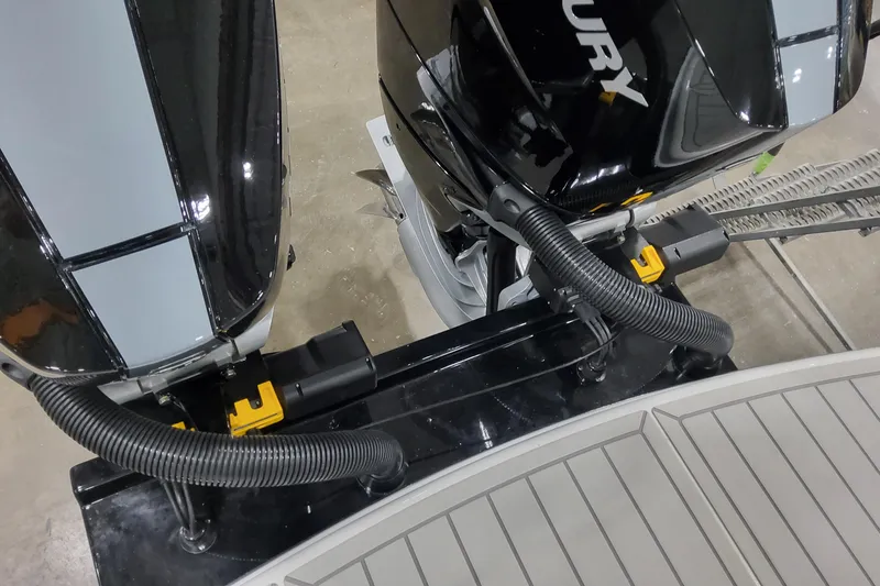 Slide: The Image of Twin outboard motors on a 2026 Formula 310 Bowrider OB boat, close-up view. - 22