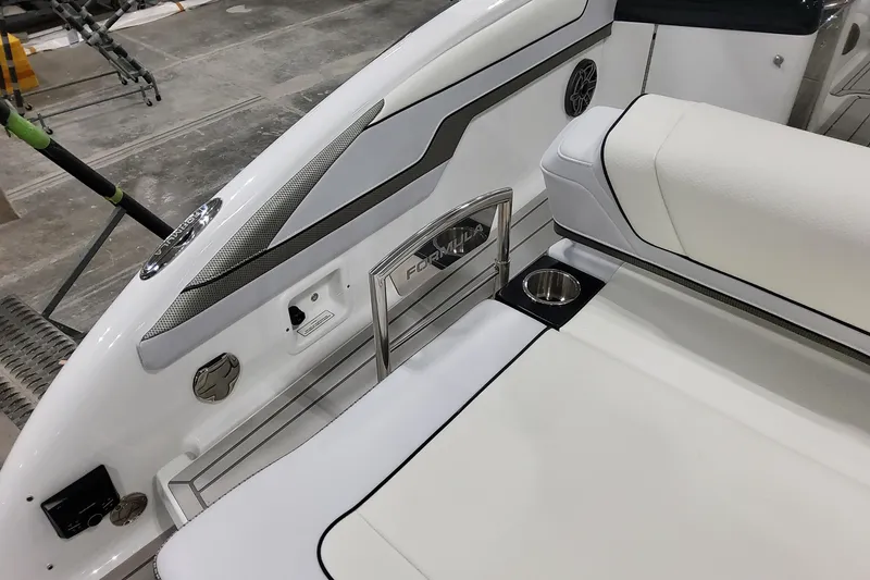 Slide: The Image of 2026 Formula 310 Bowrider OB interior with sleek white seating and cup holders. - 27