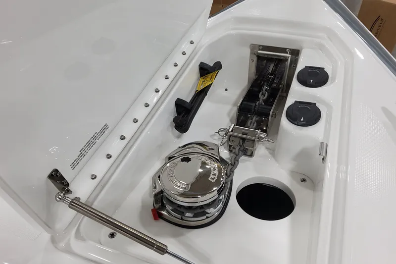 Slide: The Image of 2026 Formula 310 Bowrider OB anchor compartment with chain and winch system. - 32