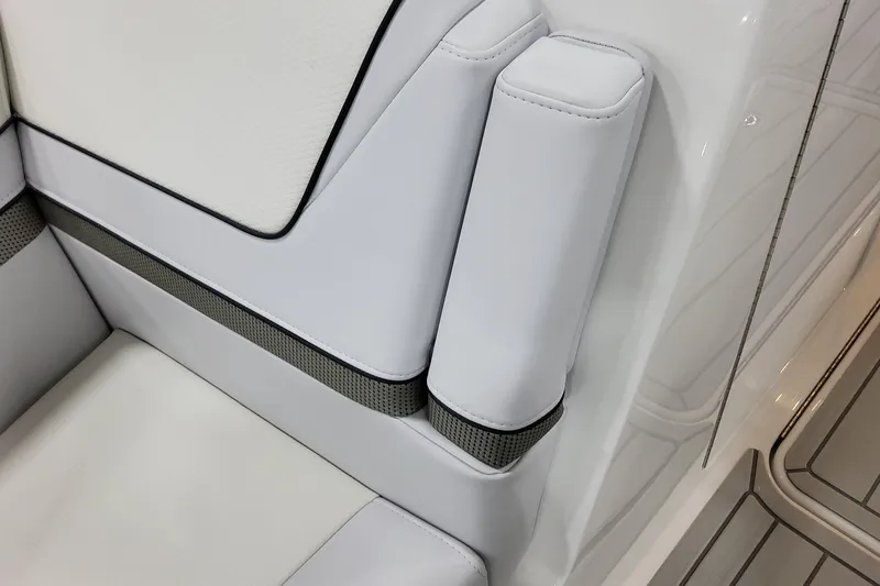 Slide: The Image of 2026 Formula 310 Bowrider OB interior seating detail with white upholstery and sleek design. - 33