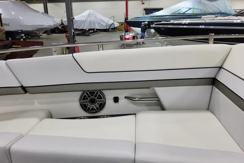 Slide: The Image of Interior of 2026 Formula 310 Bowrider OB with white seating and speaker detail. - 35