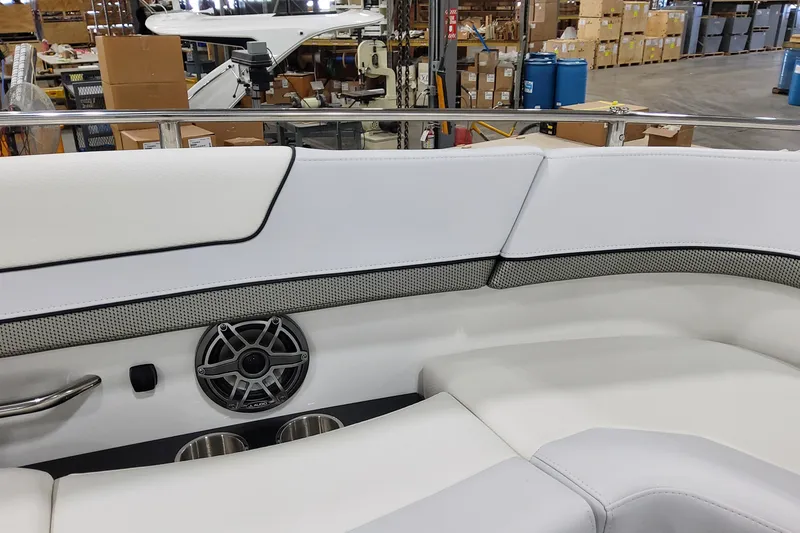 Slide: The Image of 2026 Formula 310 Bowrider OB interior with white seating and speaker detail. - 38