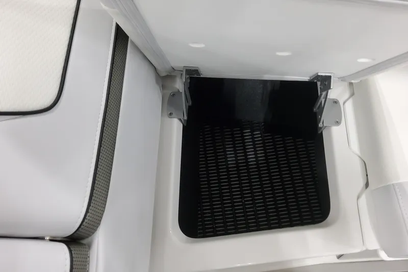 Slide: The Image of 2026 Formula 310 Bowrider OB storage compartment with white cushioned seating and black interior. - 41