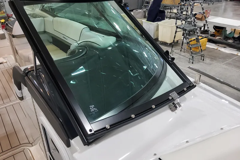 Slide: The Image of 2026 Formula 310 Bowrider OB boat interior with sleek windshield and luxurious seating. - 45