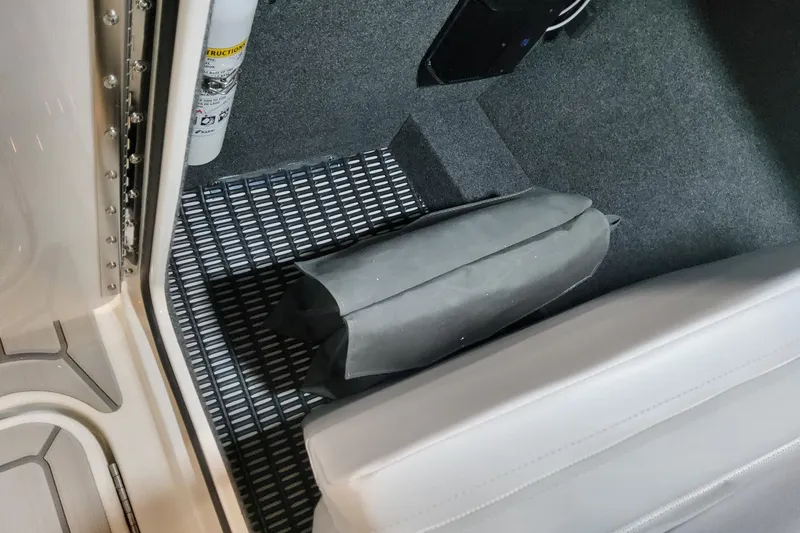 Slide: The Image of Interior of 2026 Formula 310 Bowrider OB, featuring carpeted flooring and safety equipment. - 50