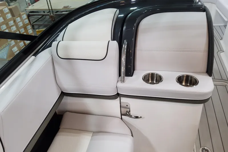 Slide: The Image of 2026 Formula 310 Bowrider OB interior with white seating and dual cup holders. - 53