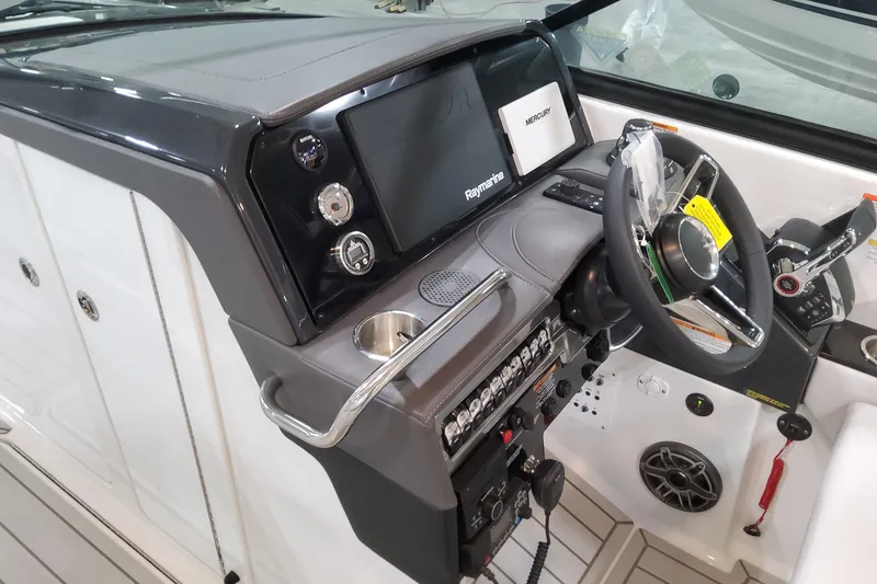 Slide: The Image of 2026 Formula 310 Bowrider OB dashboard with steering wheel and control panel. - 54