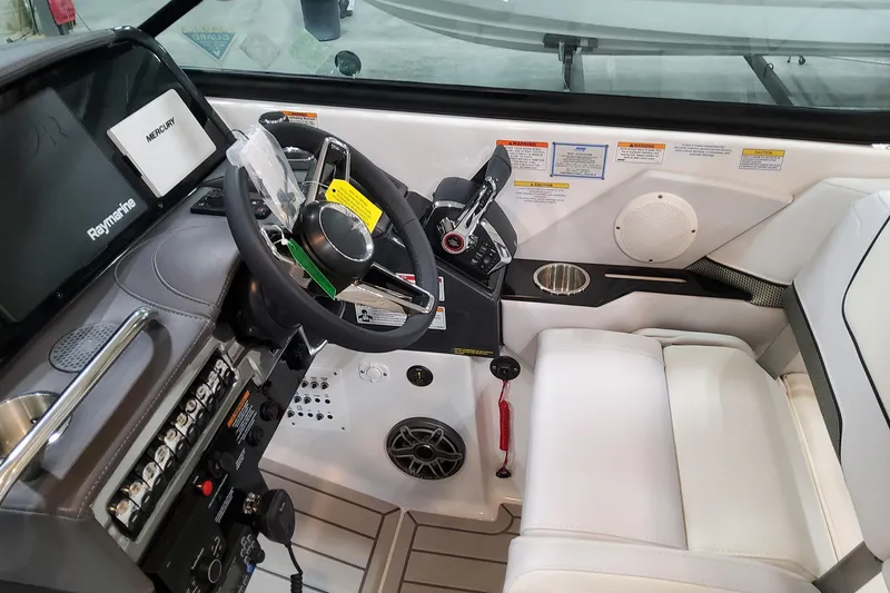 Slide: The Image of 2026 Formula 310 Bowrider OB cockpit with steering wheel, controls, and navigation system. - 55