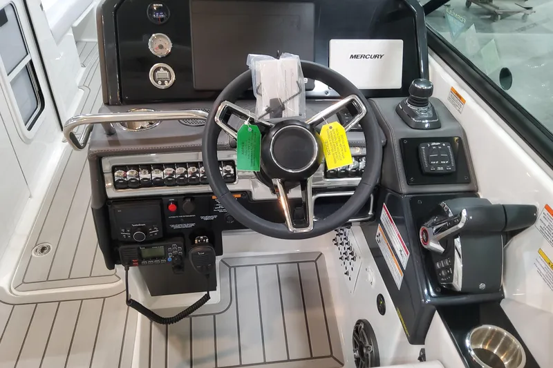 Slide: The Image of 2026 Formula 310 Bowrider OB dashboard with steering wheel and control panel. - 57