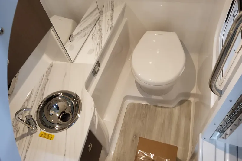Slide: The Image of 2026 Formula 310 Bowrider OB bathroom with modern sink and toilet design. - 61