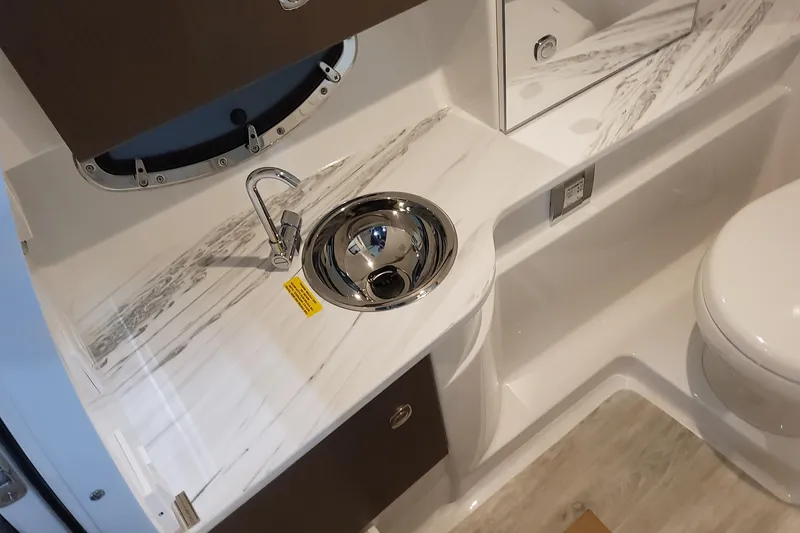 Slide: The Image of 2026 Formula 310 Bowrider OB bathroom with sleek sink and modern design. - 62