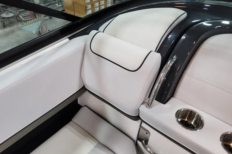Slide: The Image of 2026 Formula 310 Bowrider OB interior with white leather seats and stainless steel cup holders. - 64