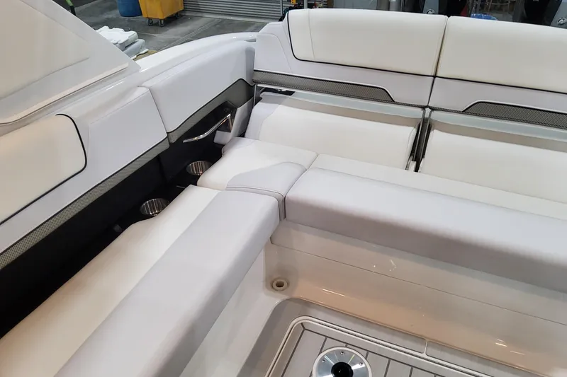 Slide: The Image of 2026 Formula 310 Bowrider OB interior with luxurious white seating and cup holders. - 75