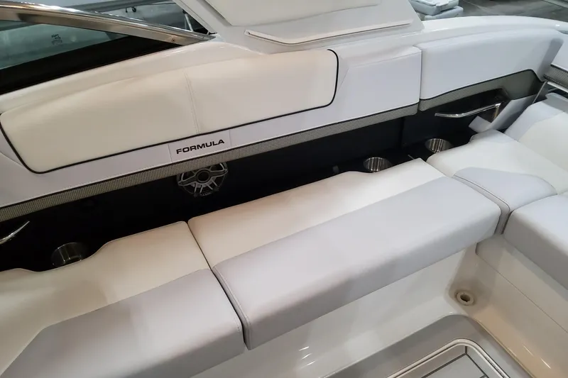 Slide: The Image of 2026 Formula 310 Bowrider OB interior with white seating and cup holders. - 76