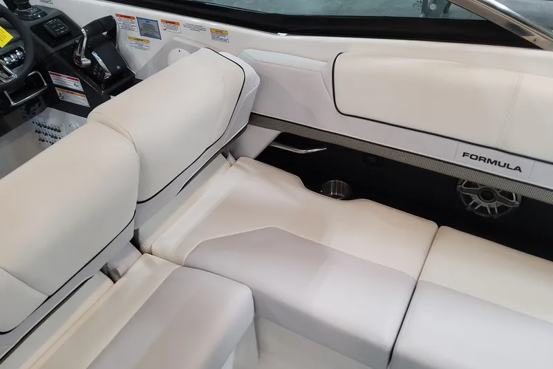 Slide: The Image of 2026 Formula 310 Bowrider OB interior with white seating and modern dashboard. - 77