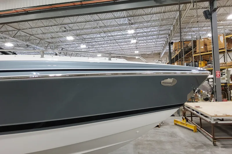 Slide: The Image of 2026 Formula 310 Bowrider OB in a warehouse, showcasing sleek design and modern features. - 8
