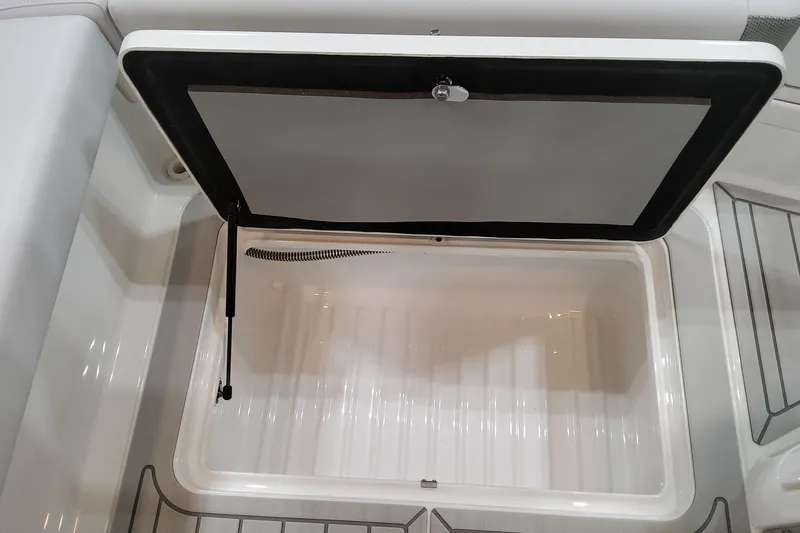 Slide: The Image of Open storage compartment in 2026 Formula 310 Bowrider OB boat. - 80