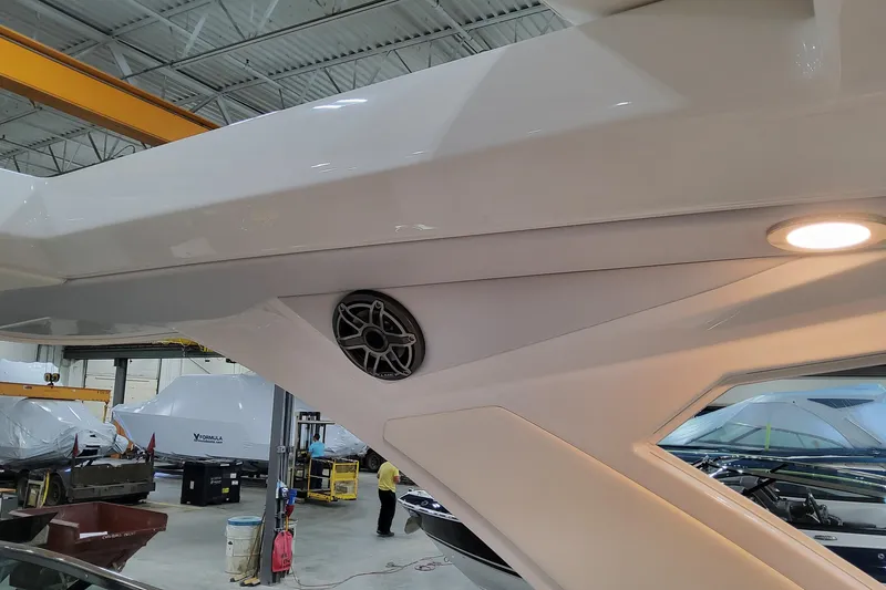 Slide: The Image of 2026 Formula 310 Bowrider OB interior detail with speaker and light in a workshop. - 85