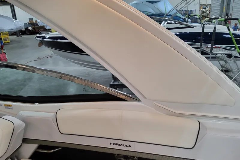 Slide: The Image of 2026 Formula 310 Bowrider OB interior with sleek white seating and modern design. - 86