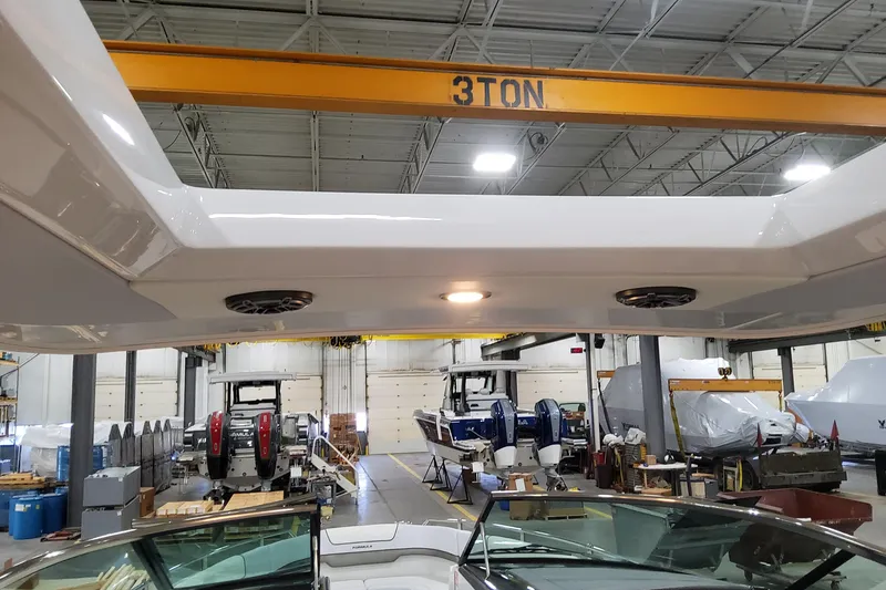 Slide: The Image of 2026 Formula 310 Bowrider OB in a workshop, showcasing interior and equipment. - 87