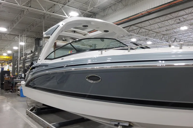 Slide: The Image of 2026 Formula 310 Bowrider OB in a showroom, showcasing sleek design and modern features. - 9