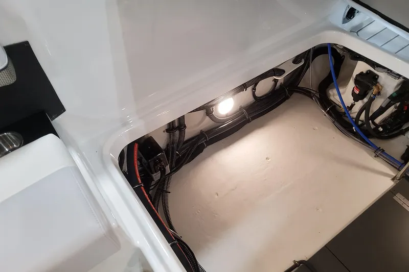 Slide: The Image of 2026 Formula 310 Bowrider OB interior wiring and storage compartment. - 90