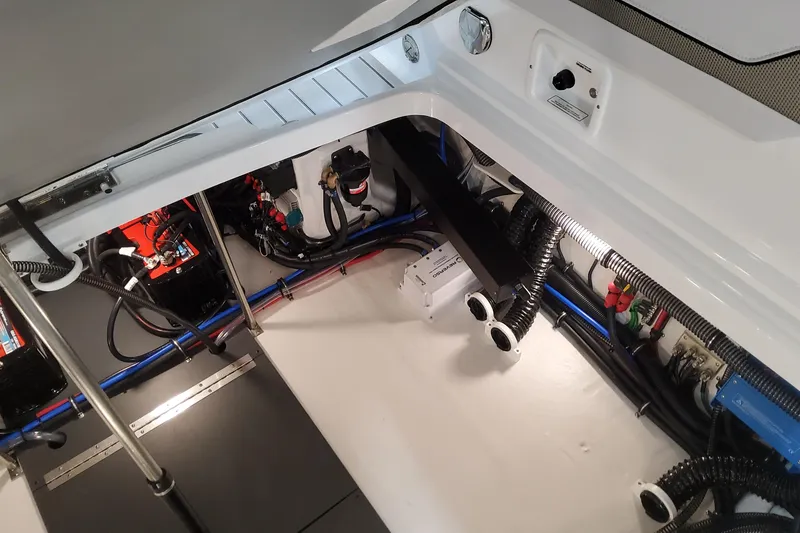 Slide: The Image of Engine compartment of 2026 Formula 310 Bowrider OB, showcasing wiring and components. - 93