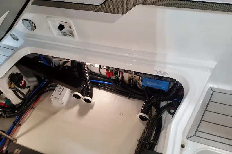 Slide: The Image of Engine compartment of 2026 Formula 310 Bowrider OB, showcasing wiring and components. - 94