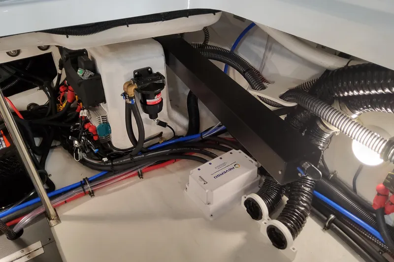 Slide: The Image of Engine compartment of 2026 Formula 310 Bowrider OB, showcasing wiring and components. - 98