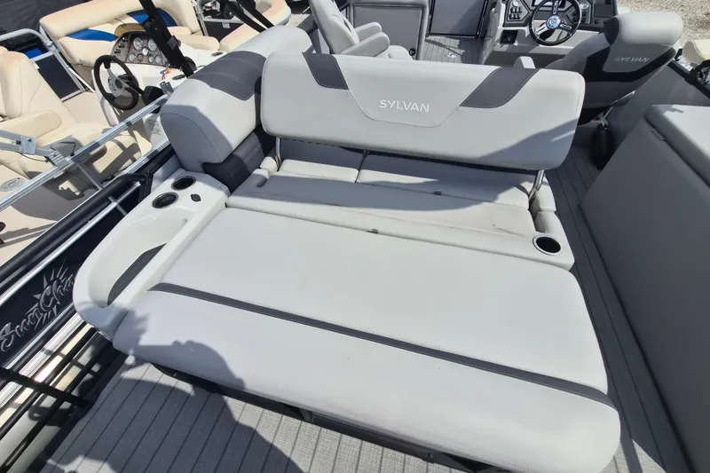 Slide: The Image of 2024 Sylvan L3 CLZ DH boat interior with comfortable seating and cup holders. - 12