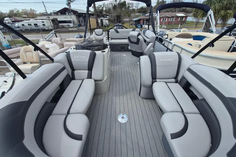 Slide: The Image of 2024 Sylvan L3 CLZ DH pontoon boat with spacious seating and modern design. - 4