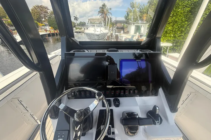 Slide: The Image of 2024 Yamaha Boats 255 FSH Sport H helm with advanced navigation displays and controls. - 22
