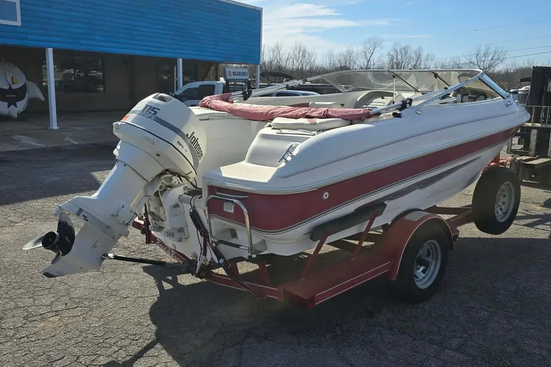 Slide: The Image of 1998 Larson 190 Ski & Fish O/B boat on trailer with Johnson outboard motor. - 5