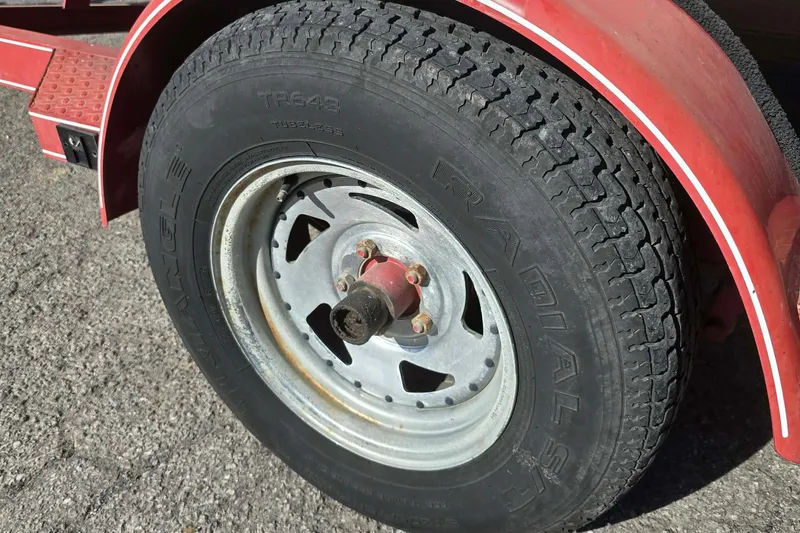 Slide: The Image of Red trailer tire for 1998 Larson 190 Ski & Fish O/B boat. - 8