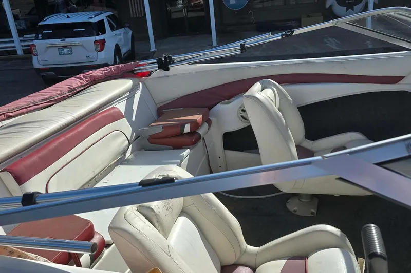 Slide: The Image of 1998 Larson 190 Ski & Fish O/B boat interior with white and red seating. - 9