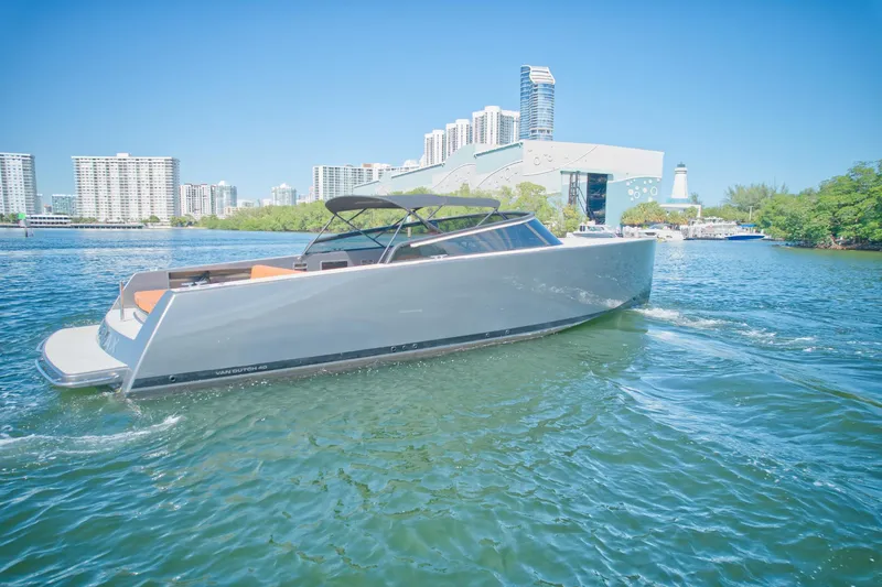 Slide: The Image of 2015 VanDutch 40 yacht cruising in urban waterfront. - 2