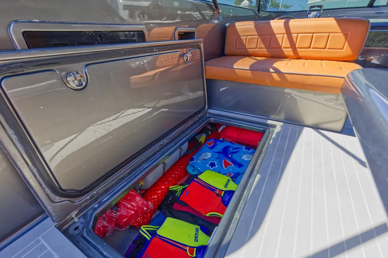 Slide: The Image of Storage compartment on a 2015 VanDutch 40 boat with life jackets and safety gear. - 28