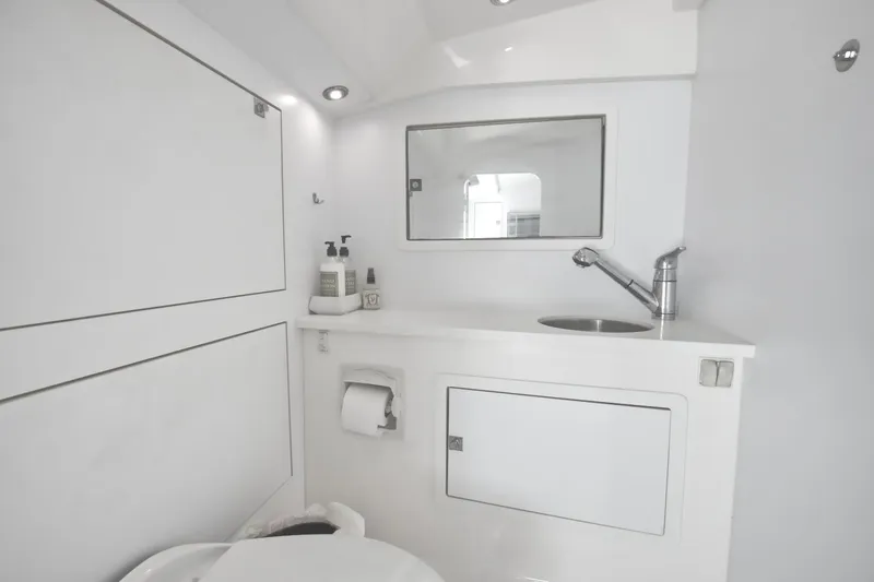 Slide: The Image of Modern bathroom in 2015 VanDutch 40 yacht with sink, mirror, and toilet. - 38