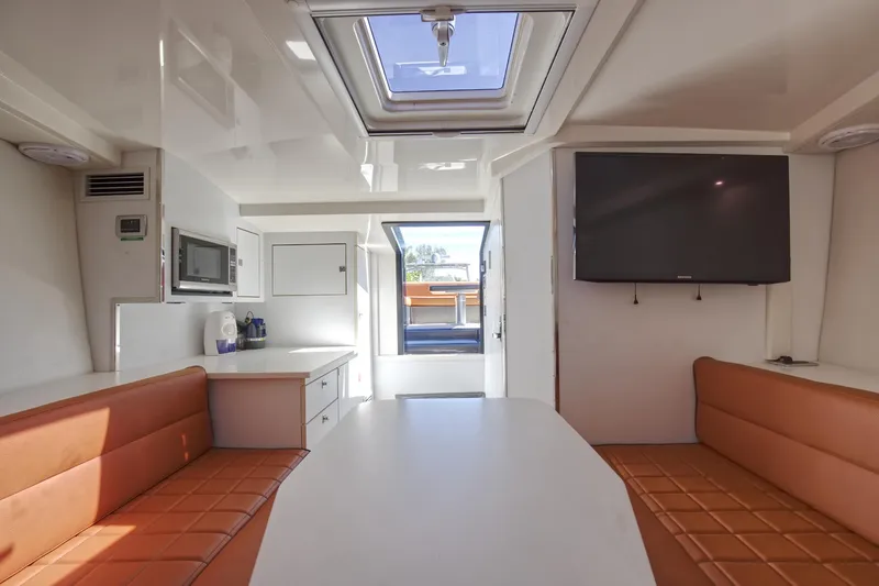 Slide: The Image of Interior of 2015 VanDutch 40 yacht with modern seating, table, and TV. - 40