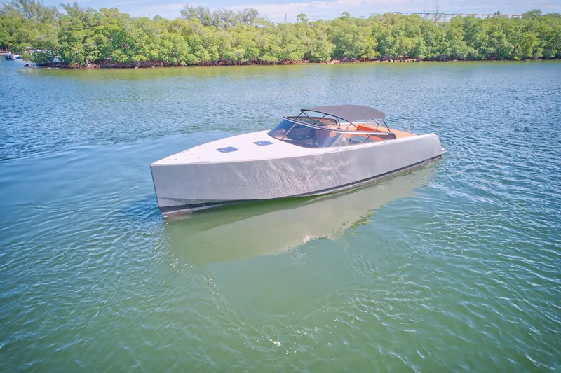 Slide: The Image of 2015 VanDutch 40 yacht cruising on a serene lake. - 7