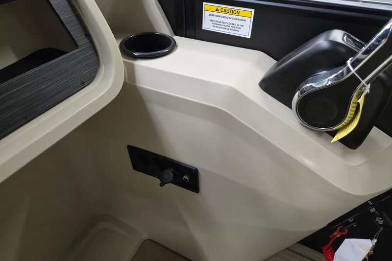 Slide: The Image of Interior view of 2026 Godfrey Sweetwater 2286 DT boat with control panel and cup holder. - 13
