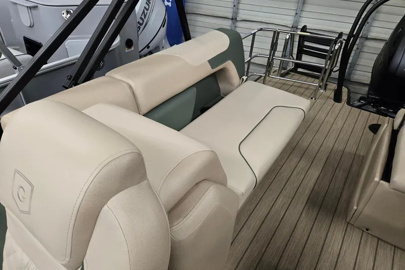 Slide: The Image of 2026 Godfrey Sweetwater 2286 DT boat interior with beige seating and wood-style flooring. - 15