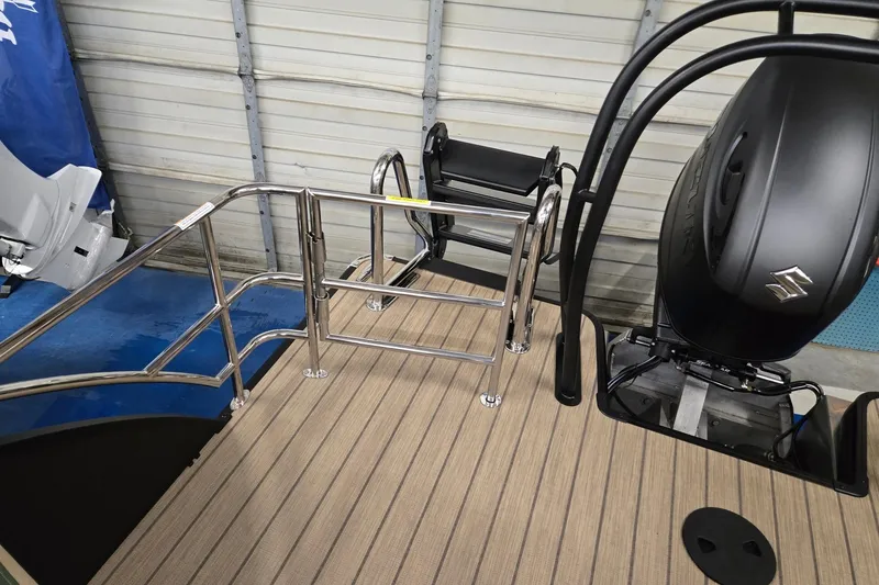 Slide: The Image of 2026 Godfrey Sweetwater 2286 DT boat deck with railing and Suzuki engine. - 17