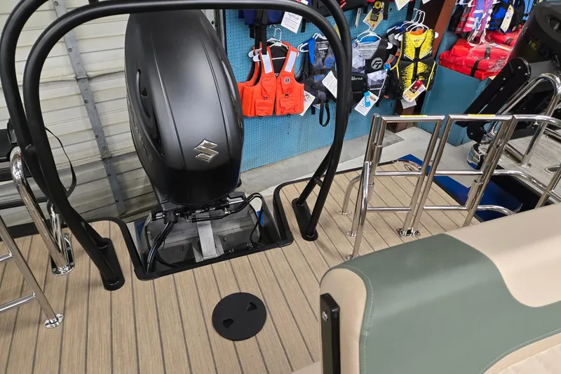 Slide: The Image of 2026 Godfrey Sweetwater 2286 DT boat with Suzuki outboard motor and safety gear display. - 18