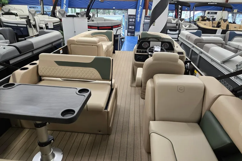 Slide: The Image of 2026 Godfrey Sweetwater 2286 DT pontoon boat interior with luxurious seating and modern dashboard. - 21