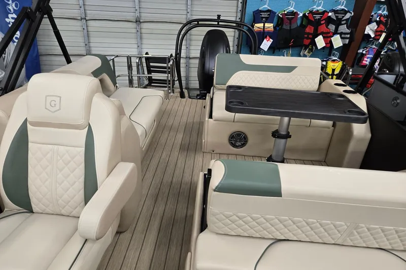 Slide: The Image of 2026 Godfrey Sweetwater 2286 DT interior with beige seating and table, showcasing luxury design. - 7